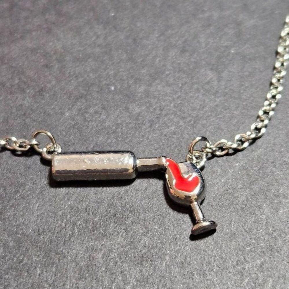 **Sale** Silver tone Wine being poured in a glass pendant necklace 20"